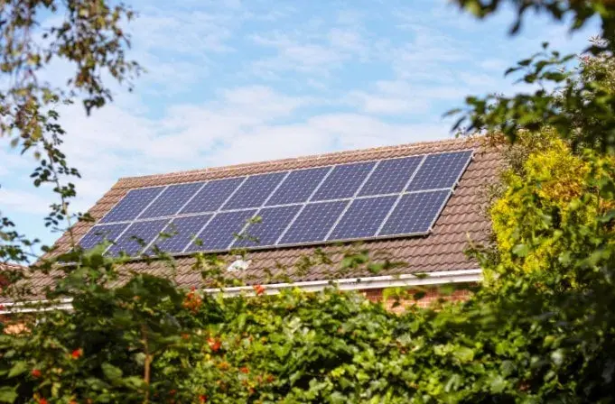 Cost effective solar panels sit on a residential house in the UK