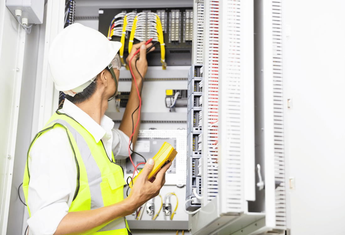 A skilled technician conducting an electrical installation and maintenance​ service.